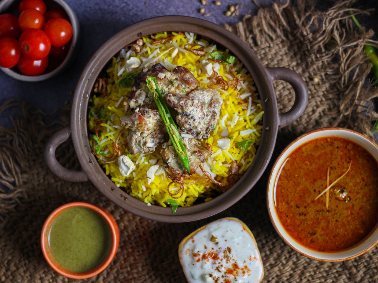 Top view of authentic biryani with accompaniments, a visual feast.